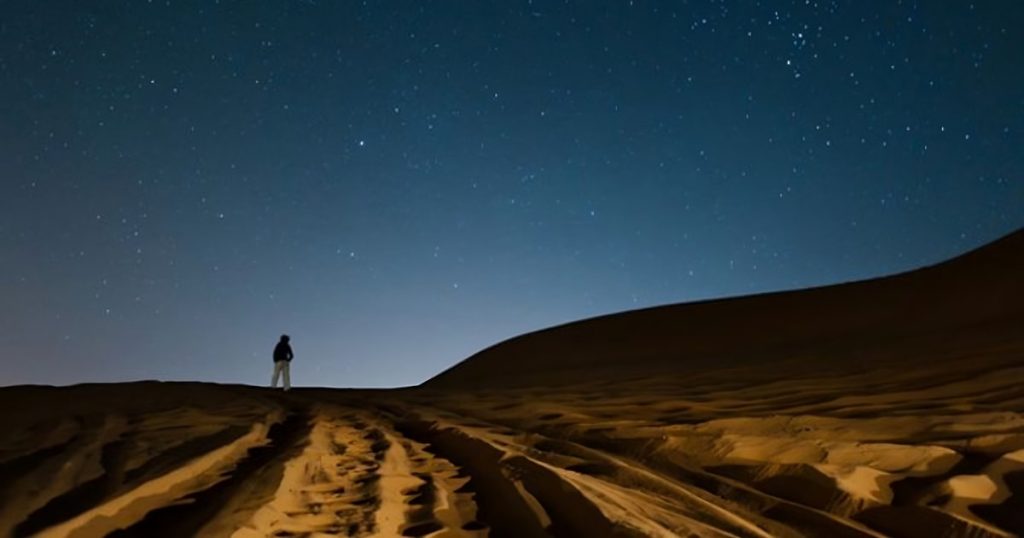Clear night sky and Milky Way view during an overnight desert safari Dubai adventure
