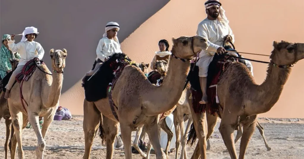 Kids enjoying camel ride during Dubai desert safari