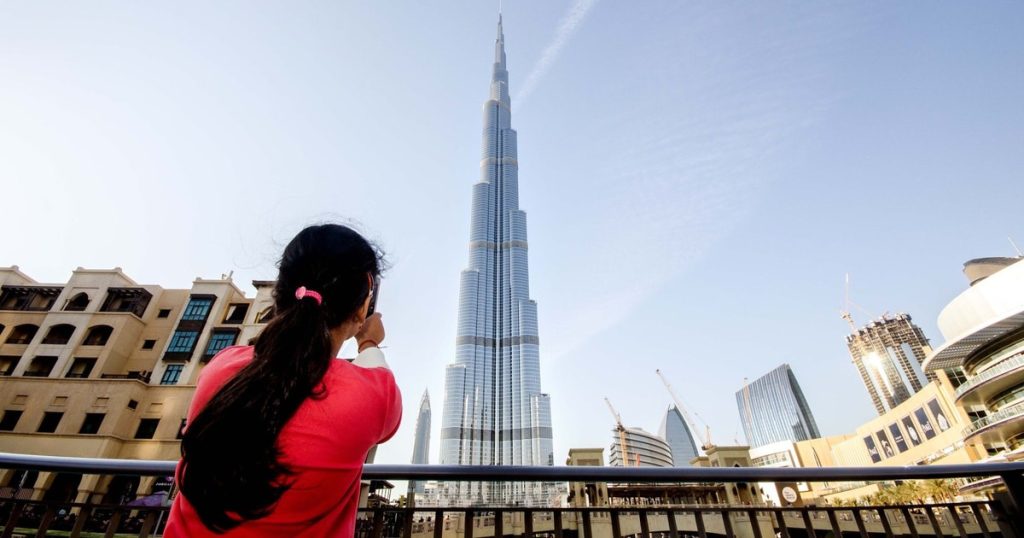Tourists enjoying Dubai city sightseeing and Burj Khalifa views
