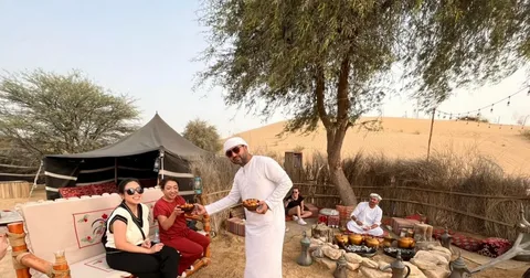 Dubai desert camp with Arabian tents and evening lights