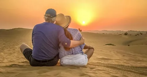 Romantic honeymoon desert safari Dubai for couples at sunset